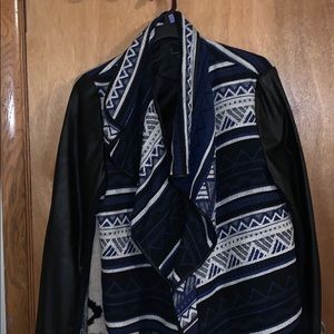 Black Pleather jacket with royal blue pattern.